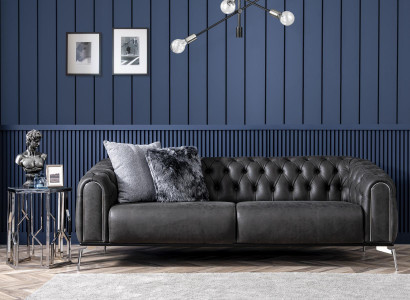 Black straight four-seater sofa in Chesterfield style for the living room.